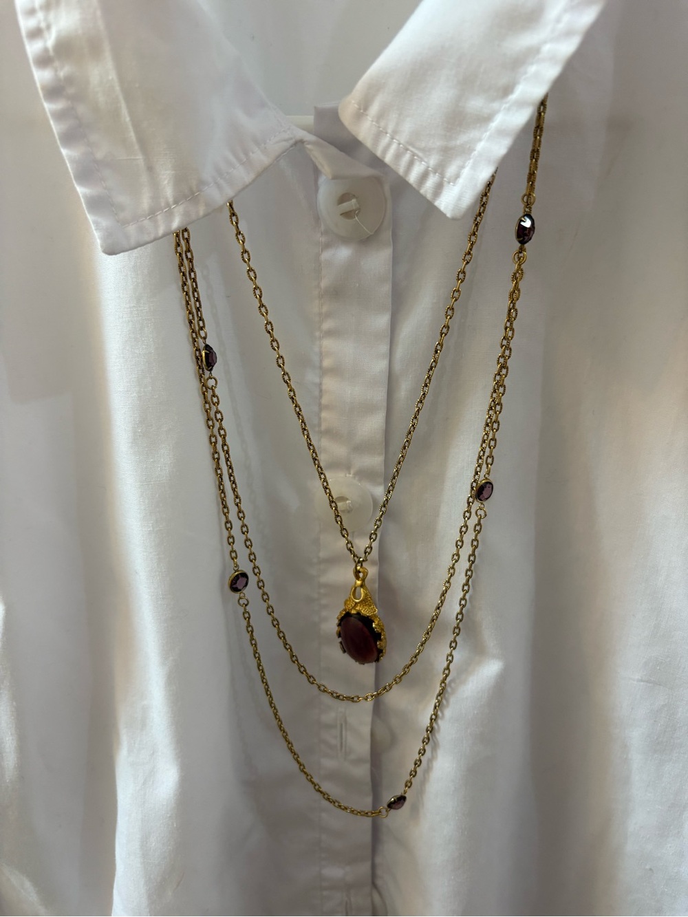 Vintage Goldette Unsigned Triple Strand Gold-Tone and Amethyst Glass Cabochons.